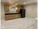 Basement with small kitchenette, carpeted floors, and ample storage at 13262 Landwood Dr, Fishers, IN 46037