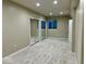 Finished basement with neutral carpeting, large mirror door closets, and natural light at 13262 Landwood Dr, Fishers, IN 46037