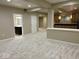 Finished basement with neutral carpeting, a wet bar, and access to a bathroom at 13262 Landwood Dr, Fishers, IN 46037