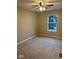 Comfortable carpeted bedroom with a ceiling fan and a bright window view at 13262 Landwood Dr, Fishers, IN 46037