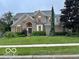 Charming two-story home with a well-maintained lawn and detailed brickwork at 13262 Landwood Dr, Fishers, IN 46037