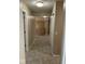Second floor hallway with neutral carpet and access to several bedrooms at 13262 Landwood Dr, Fishers, IN 46037