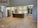 Open concept kitchen with a large island, stainless steel appliances, and hardwood flooring at 13262 Landwood Dr, Fishers, IN 46037