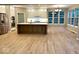 Open kitchen featuring a large island, stainless steel appliances, and custom cabinetry at 13262 Landwood Dr, Fishers, IN 46037