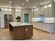 Open kitchen featuring a large island, stainless steel appliances, and custom cabinetry at 13262 Landwood Dr, Fishers, IN 46037
