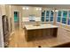 Open kitchen featuring a large island, stainless steel appliances, and custom cabinetry at 13262 Landwood Dr, Fishers, IN 46037