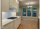 Contemporary kitchen with white countertops, stainless appliances, and herringbone backsplash at 13262 Landwood Dr, Fishers, IN 46037