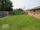 Green backyard with a wooden privacy fence at 1333 S B St, Elwood, IN 46036