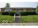 Charming single-story brick home with well-maintained landscaping and inviting front entrance at 1333 S B St, Elwood, IN 46036