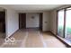 Bright living room featuring a large window and neutral paint at 1333 S B St, Elwood, IN 46036