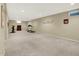 Finished basement includes work out equipment and large open carpeted floor plan at 1411 N Claridge Way, Carmel, IN 46032
