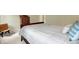 Bedroom boasts a vintage bench and a dark wood dresser at 1411 N Claridge Way, Carmel, IN 46032
