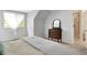 Cozy bedroom features neutral decor, a dresser, and an attached bathroom with glass enclosed shower at 1411 N Claridge Way, Carmel, IN 46032
