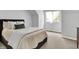 Bright bedroom with plush carpeting and a large window with sheer curtains at 1411 N Claridge Way, Carmel, IN 46032