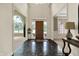Elegant foyer with marble floors, arched doorways and a view to other rooms at 1411 N Claridge Way, Carmel, IN 46032