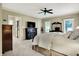 Spacious main bedroom featuring soft carpet, a fireplace, and two windows bringing in plenty of light at 1411 N Claridge Way, Carmel, IN 46032