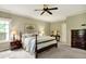 Comfortable main bedroom featuring soft carpet, neutral colors, and traditional furniture at 1411 N Claridge Way, Carmel, IN 46032