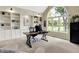 Bright office with built-in bookshelves, a large arched window, and modern desk at 1411 N Claridge Way, Carmel, IN 46032