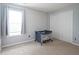 Bright bedroom with tan carpet, light gray walls, window, baby playpen, and a white double-door closet at 16095 Tenor Way, Noblesville, IN 46060