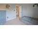 Bedroom with a baby's daybed, gray walls, neutral carpet, and blue chest of drawers at 16095 Tenor Way, Noblesville, IN 46060