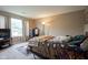 Comfortable bedroom with a plush bed, large window, and cozy decor at 16095 Tenor Way, Noblesville, IN 46060