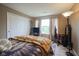 Comfortable bedroom with a large window, a closet, and inviting carpet at 16095 Tenor Way, Noblesville, IN 46060
