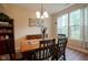 Inviting dining room with a chandelier, natural light, and charming decor at 16095 Tenor Way, Noblesville, IN 46060