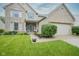 Beautiful brick home with a well-manicured lawn, attractive landscaping, and an attached garage at 16095 Tenor Way, Noblesville, IN 46060