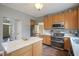 Kitchen featuring a marble countertop island, stainless steel appliances, and wood-look flooring at 16095 Tenor Way, Noblesville, IN 46060
