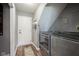 Convenient laundry room with modern appliances, a gray color scheme, and access to closet storage at 16095 Tenor Way, Noblesville, IN 46060