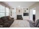 Living room featuring a fireplace, built-in shelving, and neutral-toned furnishings for a cozy space at 16095 Tenor Way, Noblesville, IN 46060