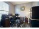 Well-lit home office with a large desk, dual monitors, and modern accessories at 16095 Tenor Way, Noblesville, IN 46060