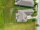 Aerial view of a well-maintained home showcasing lush green lawns, mature trees, and a driveway at 16548 Grand Cypress Dr, Noblesville, IN 46060