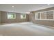 Spacious finished basement with large windows for natural light and neutral carpet at 16548 Grand Cypress Dr, Noblesville, IN 46060