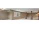 A large, finished basement with brick-and-wood support beams and recessed lighting at 16548 Grand Cypress Dr, Noblesville, IN 46060