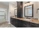 Bathroom with double sink vanity, granite countertops, and modern fixtures at 16548 Grand Cypress Dr, Noblesville, IN 46060