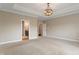 Open bedroom featuring a view of the ensuite bathroom and an open doorway at 16548 Grand Cypress Dr, Noblesville, IN 46060