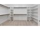 Walk-in closet with custom shelving and ample storage space at 16548 Grand Cypress Dr, Noblesville, IN 46060