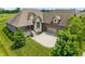 Charming brick home featuring manicured lawn, stone accents, and a convenient two car attached garage at 16548 Grand Cypress Dr, Noblesville, IN 46060