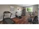 Bright home gym featuring modern exercise equipment and hardwood floors for a great workout space at 16548 Grand Cypress Dr, Noblesville, IN 46060