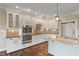 Modern kitchen with white cabinetry, stainless steel appliances, and a spacious island at 16548 Grand Cypress Dr, Noblesville, IN 46060