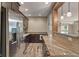 Charming kitchenette with stainless steel appliances, granite countertops, and wood-look flooring at 16548 Grand Cypress Dr, Noblesville, IN 46060