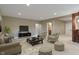 Inviting living room with neutral colors, comfortable seating, and decorative area rug at 16548 Grand Cypress Dr, Noblesville, IN 46060