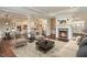 Bright and airy living room featuring a cozy seating area with a fireplace at 16548 Grand Cypress Dr, Noblesville, IN 46060