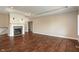 Living room showcasing a fireplace, hardwood floors, and neutral wall colors at 16548 Grand Cypress Dr, Noblesville, IN 46060
