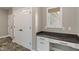 Mud room with built-in desk, overhead lighting, and tile floors at 16548 Grand Cypress Dr, Noblesville, IN 46060
