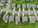 An aerial view of a neighborhood featuring well-manicured lawns and varied home styles at 16551 Branham Dr, Fishers, IN 46040