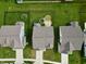 An aerial view of a landscaped backyard with a fenced perimeter, trampoline, and well-maintained lawn at 16551 Branham Dr, Fishers, IN 46040