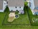 Aerial view of fenced backyard with trampoline, garden, and patio area at 16551 Branham Dr, Fishers, IN 46040