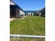 Well-maintained backyard featuring a large grassy area and a storage shed at 2021 Columbia Ave, Indianapolis, IN 46202